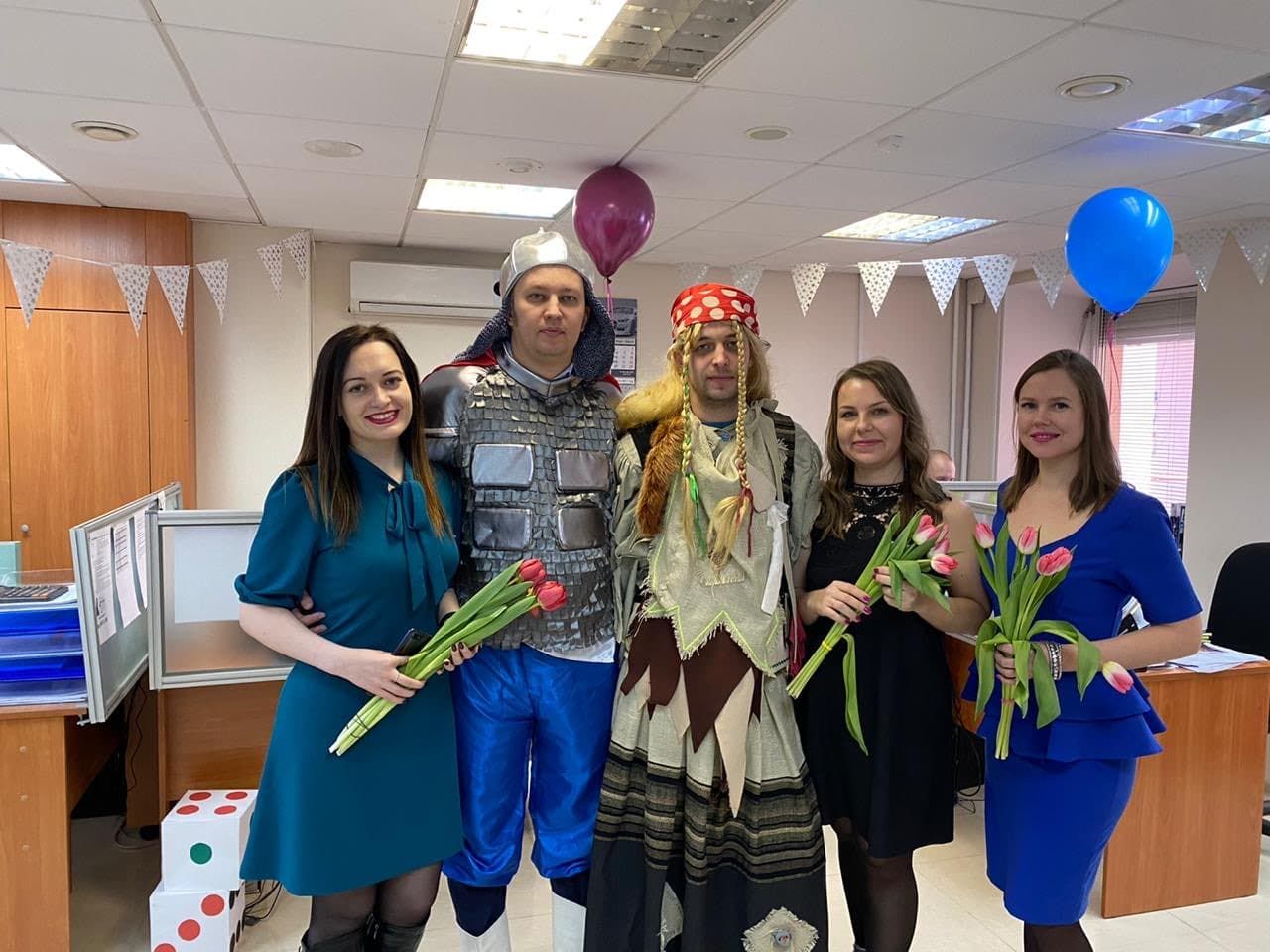 3 women wearing mask holding bouquet of flowers