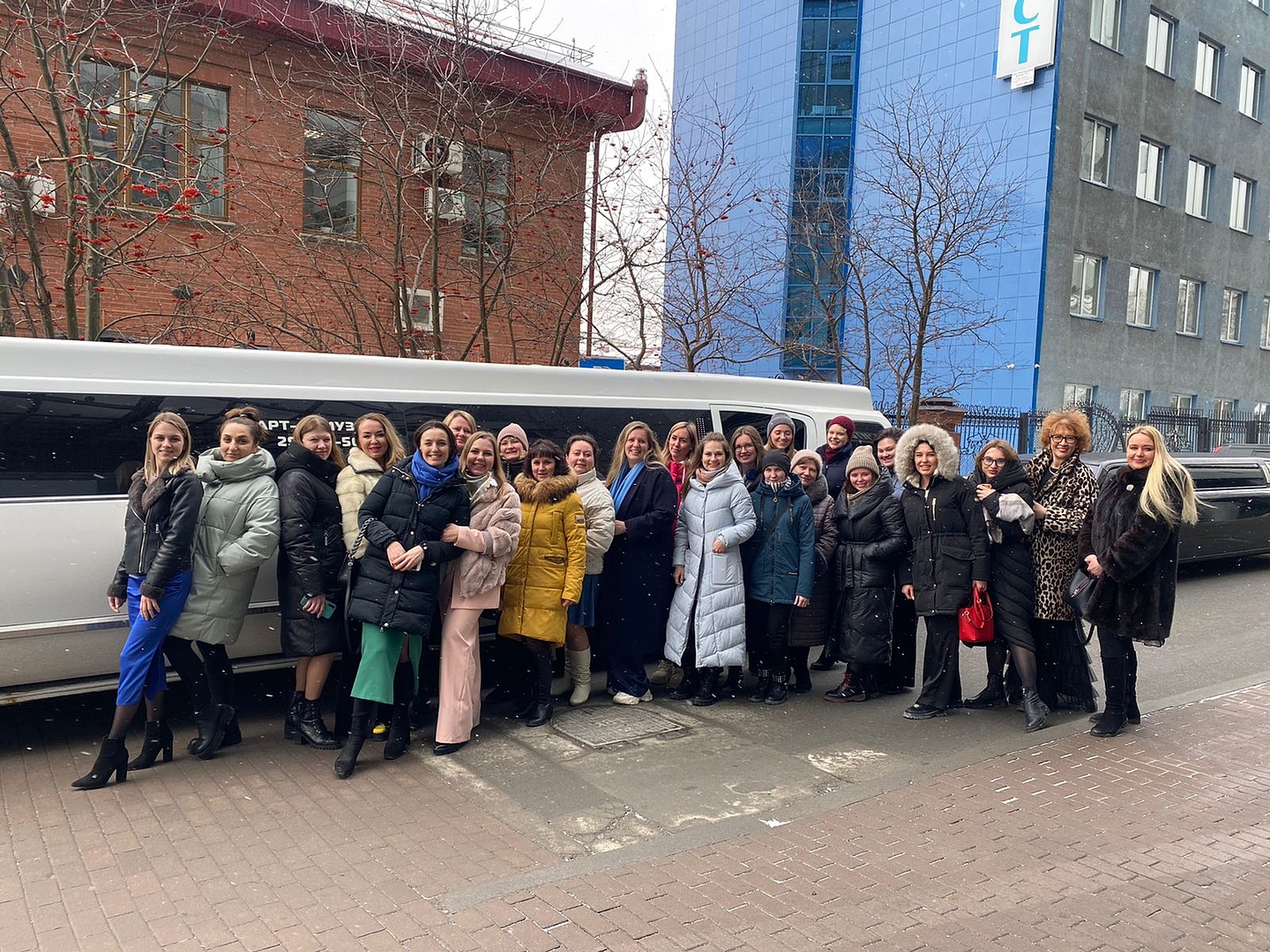 group of people standing on snow covered ground